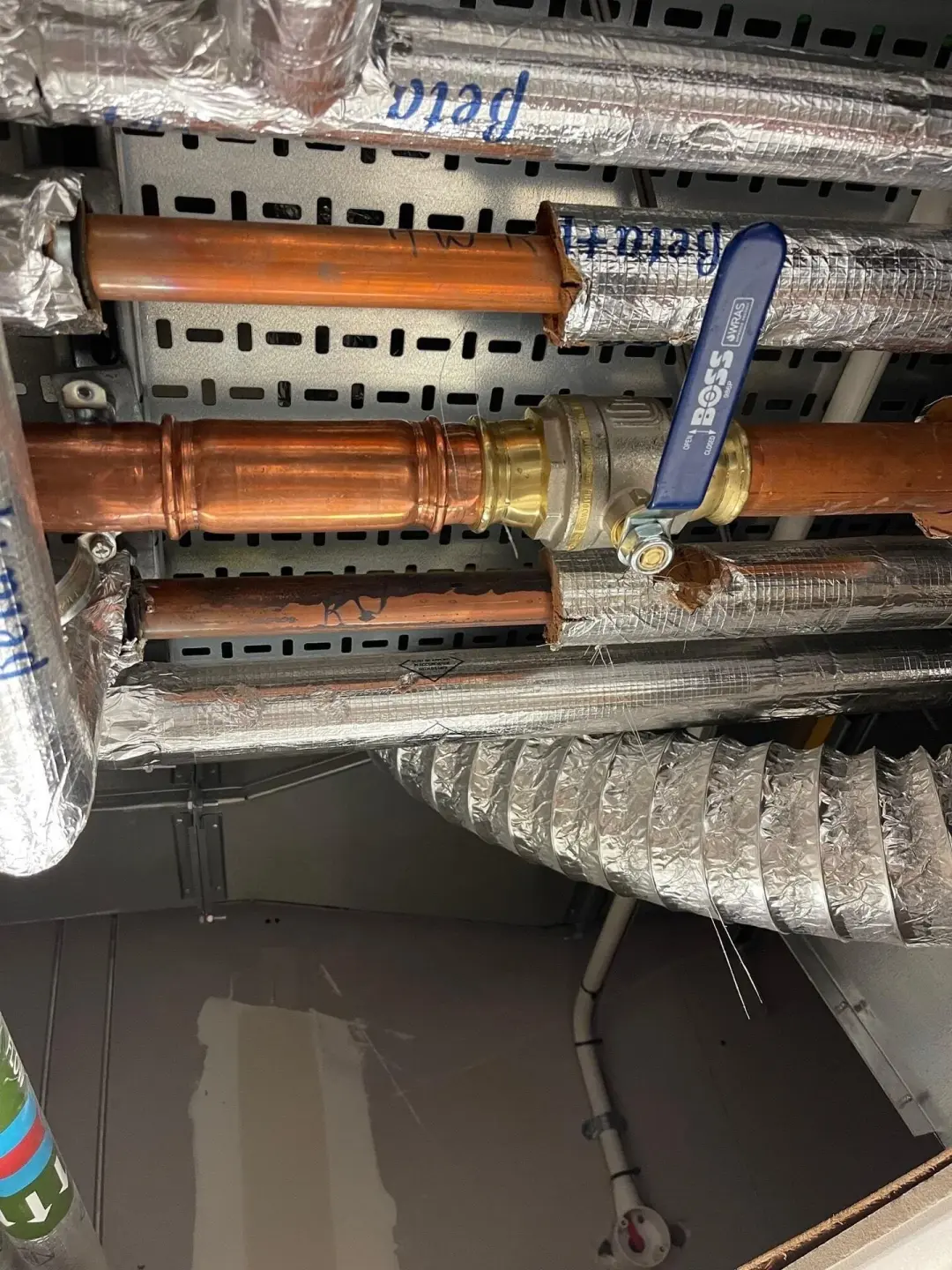 Copper pipework and an isolation valve in a ceiling void